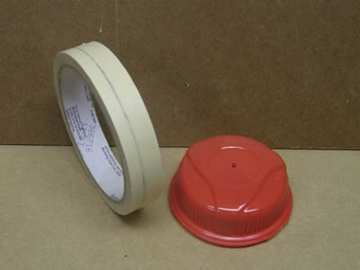 Masking tape and bottle lid